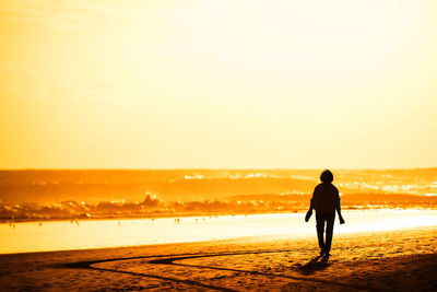 Silhouette of people on beach