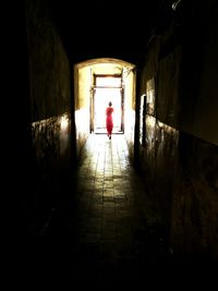 Full length of woman walking in tunnel