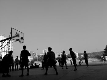 People against clear sky