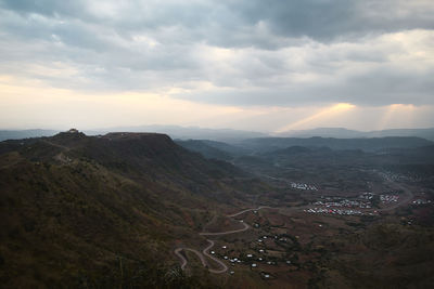 Scenic view of mountains against sky during sunset