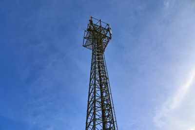 Low angle view of communications tower against sky