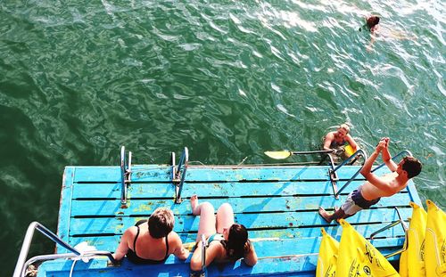 People on boat in sea