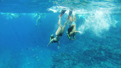 People swimming in sea