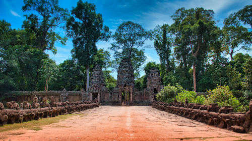 View of temple amidst trees against sky