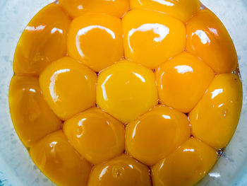 High angle view of yellow eggs in bowl