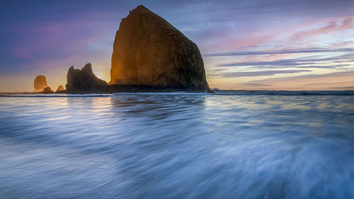 Scenic view of sea against sky during sunset