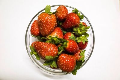 Directly above shot of strawberries on white background