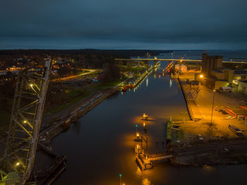 High angle view of illuminated buildings in city at night