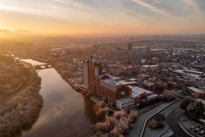 High angle view of cityscape against sky during sunset