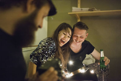 Friends taking photos at a party