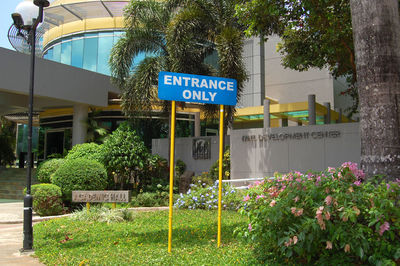 Information sign against trees and plants