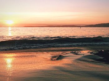 Scenic view of sea at sunset