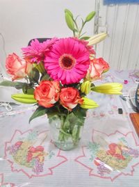 Close-up of pink roses in vase on table