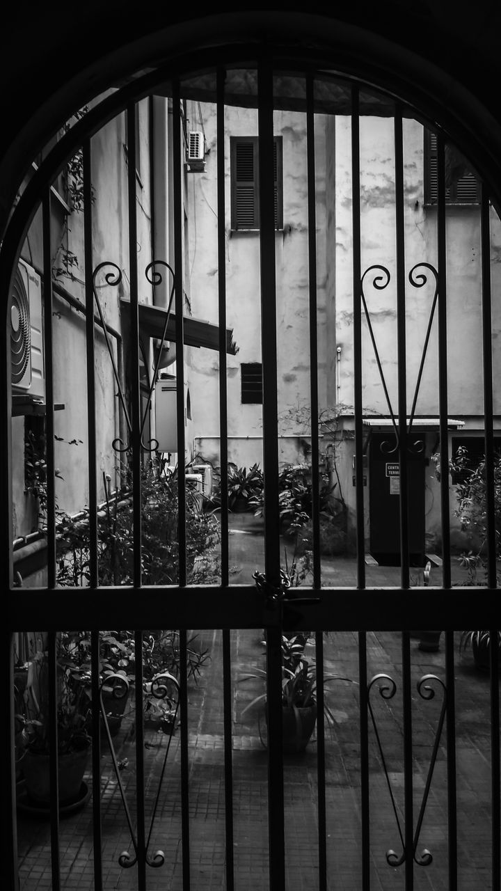 REFLECTION OF WINDOW ON GLASS BUILDING