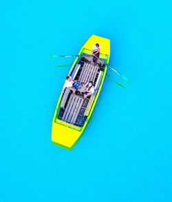 Aerial view of people sitting in boat