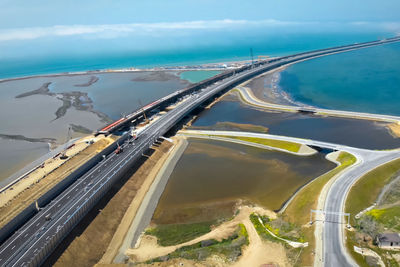 High angle view of bridge over sea against sky