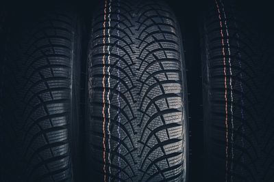 Full frame shot of tires against black background