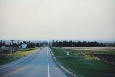 Empty road against sky