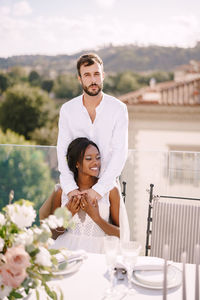 Portrait of young couple on table