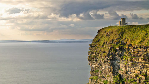 Scenic view of sea against cloudy sky