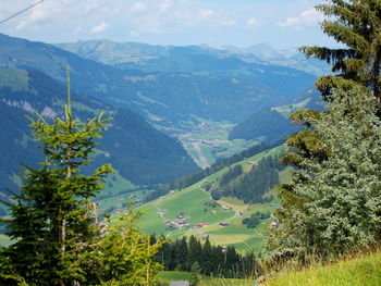 Scenic view of landscape and mountains against sky