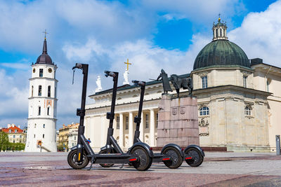 Electric urban transportation, row of electric readies to ride scooter bikes with accumulators