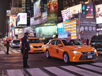 Police men standing on street during rush hour in city