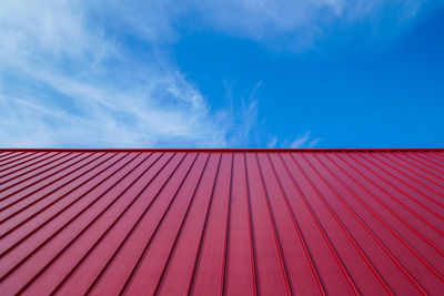 Red roof against blue sky