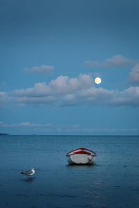 Boat in sea against sky