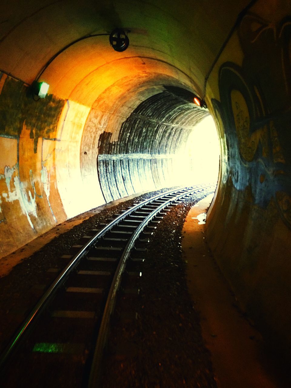 indoors, the way forward, diminishing perspective, tunnel, vanishing point, transportation, railroad track, illuminated, architecture, rail transportation, built structure, ceiling, arch, public transportation, empty, subway, no people, lighting equipment, railroad station, light at the end of the tunnel