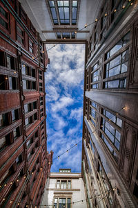 Low angle view of apartment buildings against sky