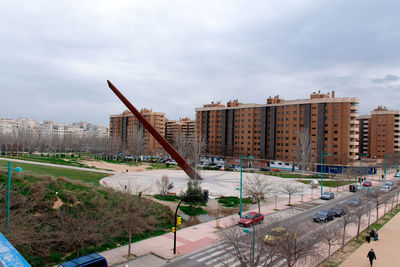 High angle view of city buildings against sky