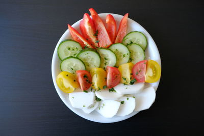 High angle view of fruits in bowl on table