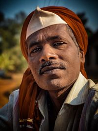 Close-up portrait of man wearing hat