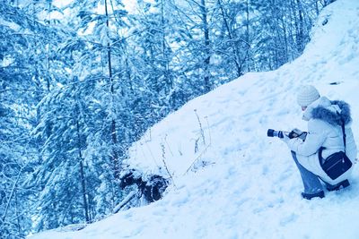 Close-up of photographer in snow