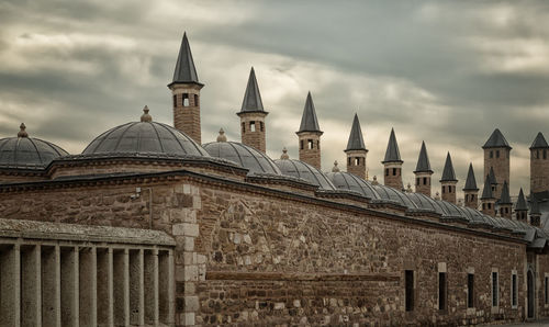 View of mosque against cloudy sky