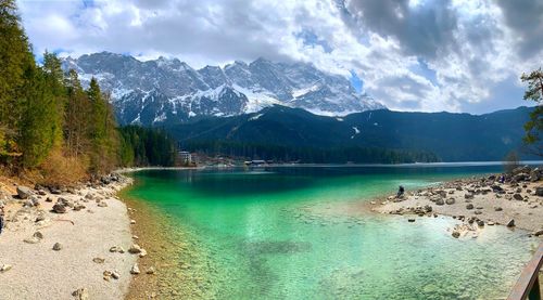 Panoramic view of lake and mountains against sky