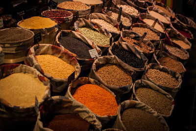 High angle view of spices and dries beans for sale in market