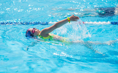 Girl swimming in pool