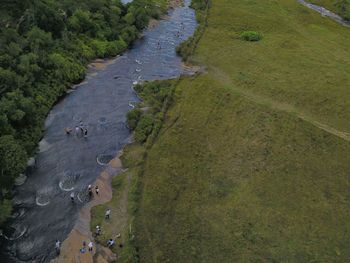 Aerial view of river flowing by landscape