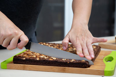 Midsection of man preparing food on table