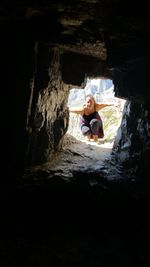 Portrait of woman seen through cave