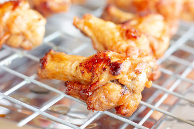 Close-up of serving meat on barbecue grill