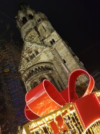 Low angle view of illuminated building at night