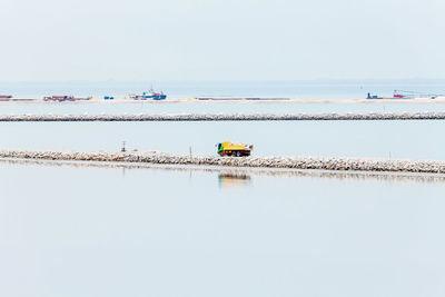 Nautical vessel on sea against clear sky