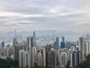 Aerial view of modern buildings in city against sky