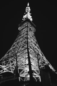 Low angle view of illuminated building against sky at night