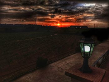 Scenic view of field against sky during sunset