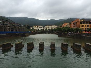 Scenic view of river and mountains against sky