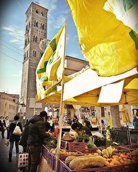People at market stall in city